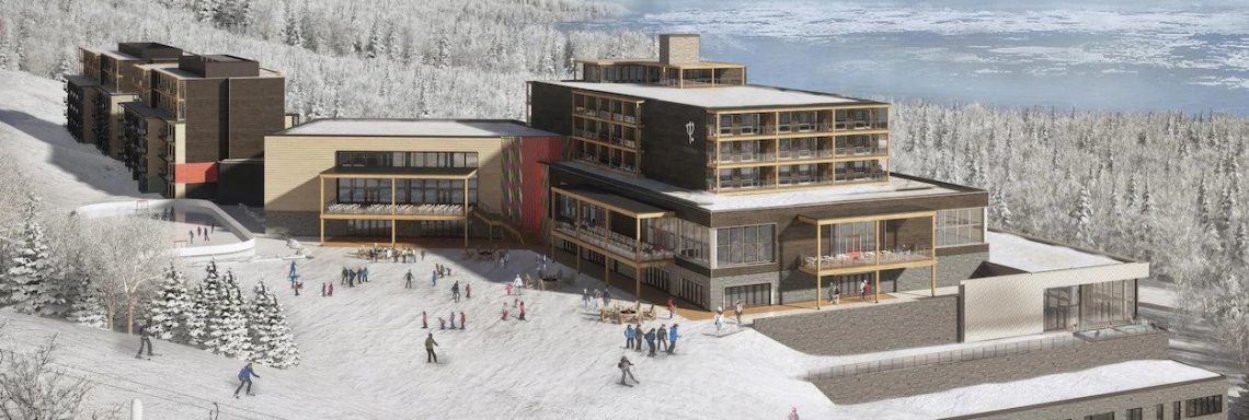 Vue extérieure du Club Med avec une forêt enneigée etdu fleuve en arrière-plan